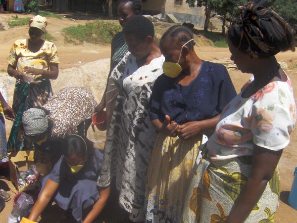 helping-widows-with-aids-in-Tanzania-mixing-colours.